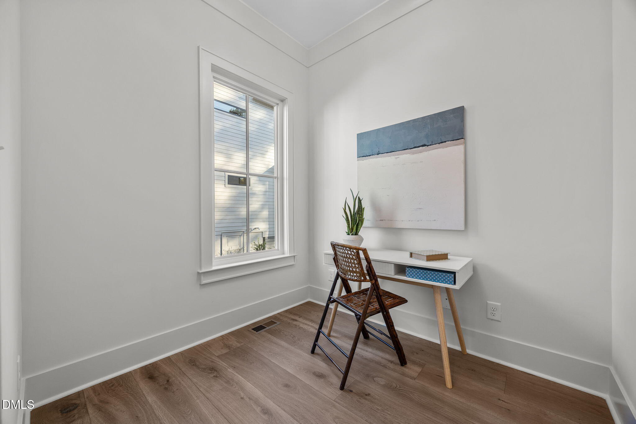 1000 Canterbury Road Raleigh, NC 27607 - Photo 22 of 46 a workspace room with a table and windows