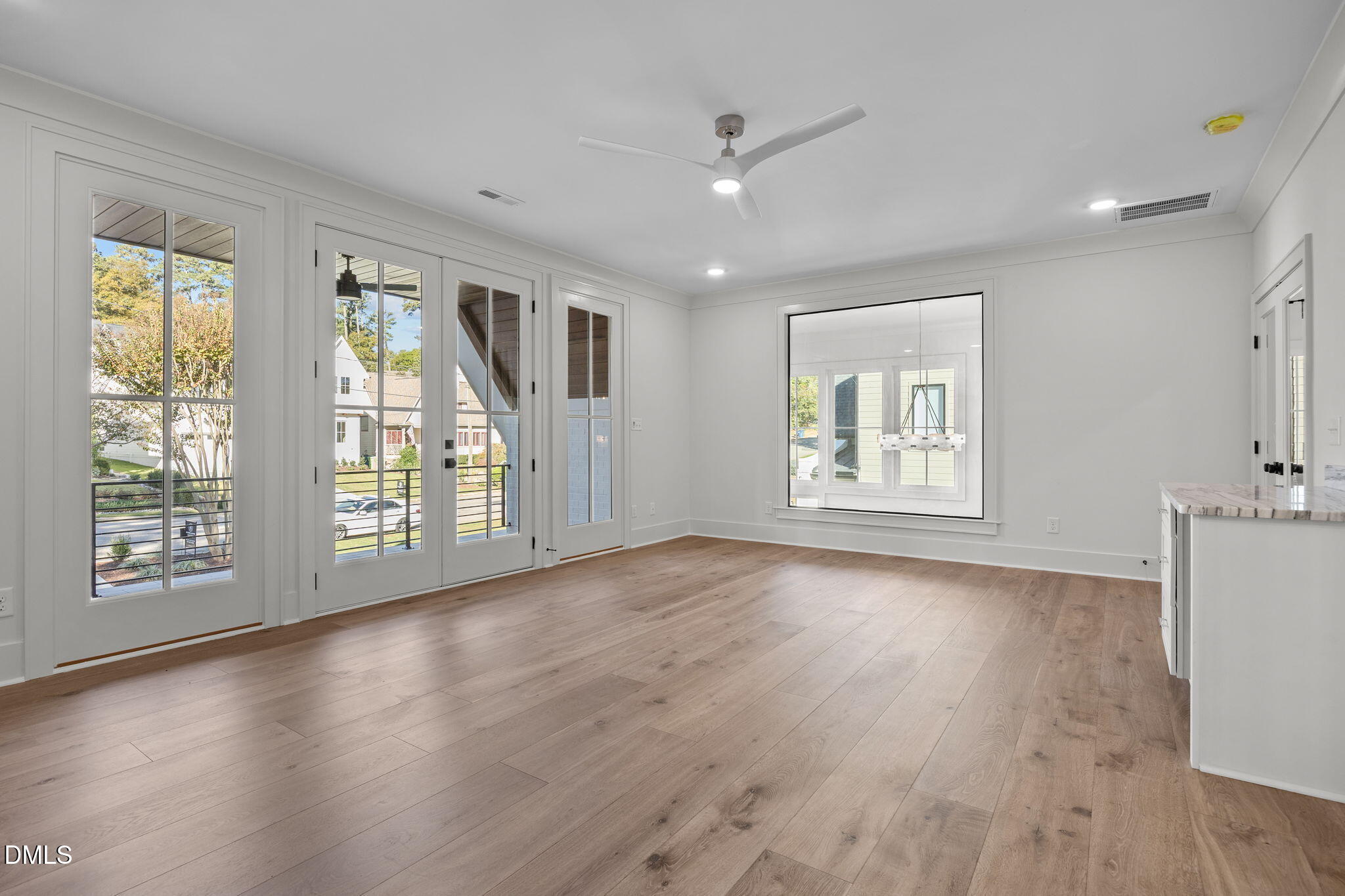 1000 Canterbury Road Raleigh, NC 27607 - Photo 24 of 46 a view of an empty room with a window and wooden floor