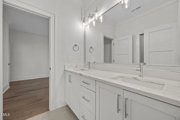a kitchen with granite countertop a center island stainless steel appliances cabinets and a center island