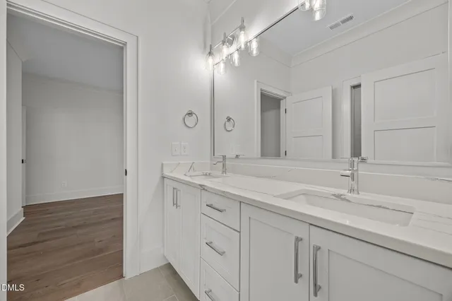 a kitchen with granite countertop a center island stainless steel appliances cabinets and a center island