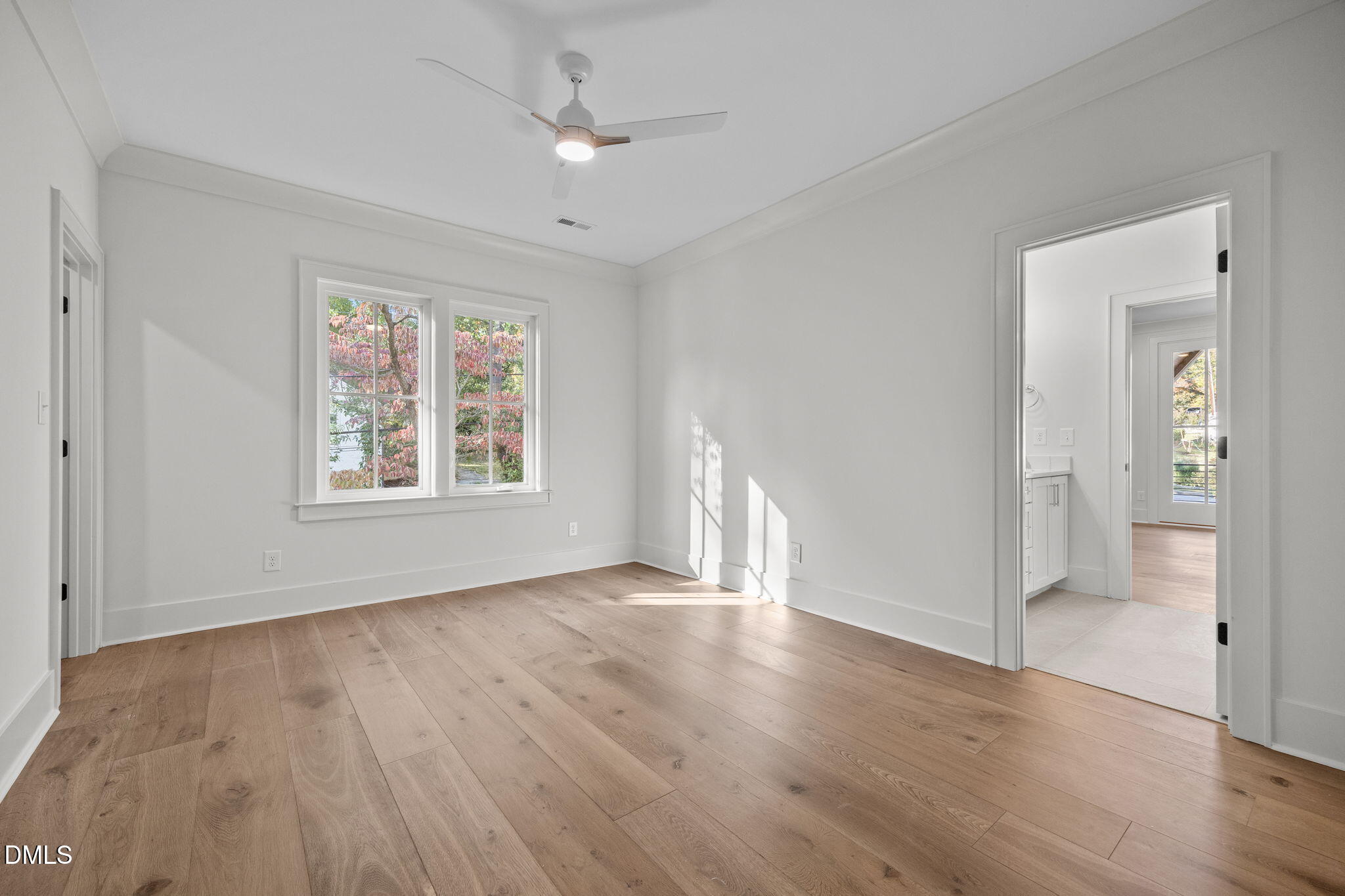 1000 Canterbury Road Raleigh, NC 27607 - Photo 28 of 46 a view of an empty room with window and wooden floor