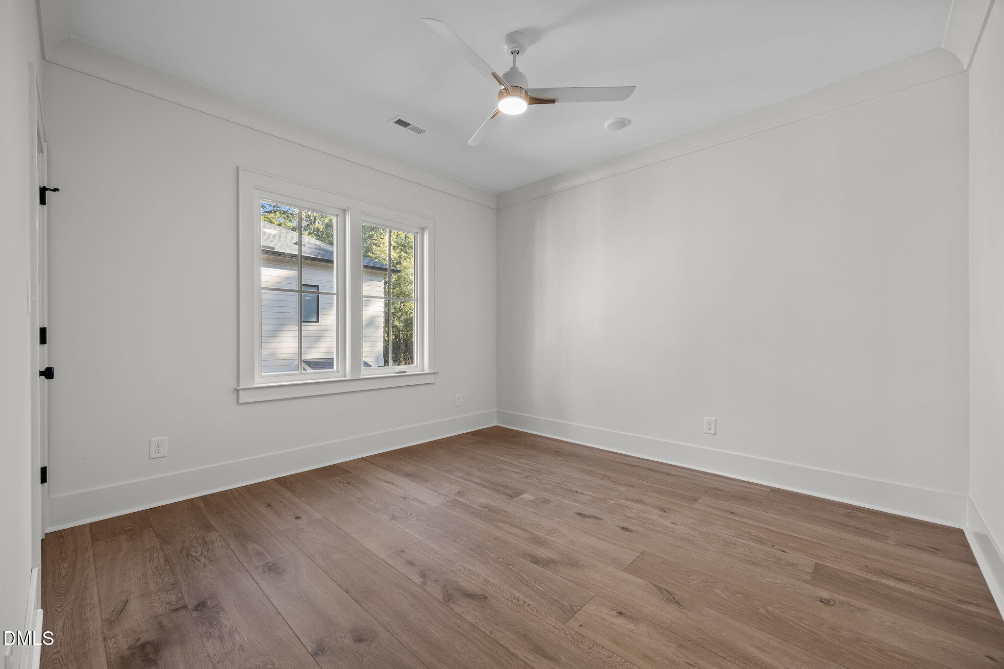 1000 Canterbury Road Raleigh, NC 27607 - Photo 30 of 46 wooden floor in an empty room with a window