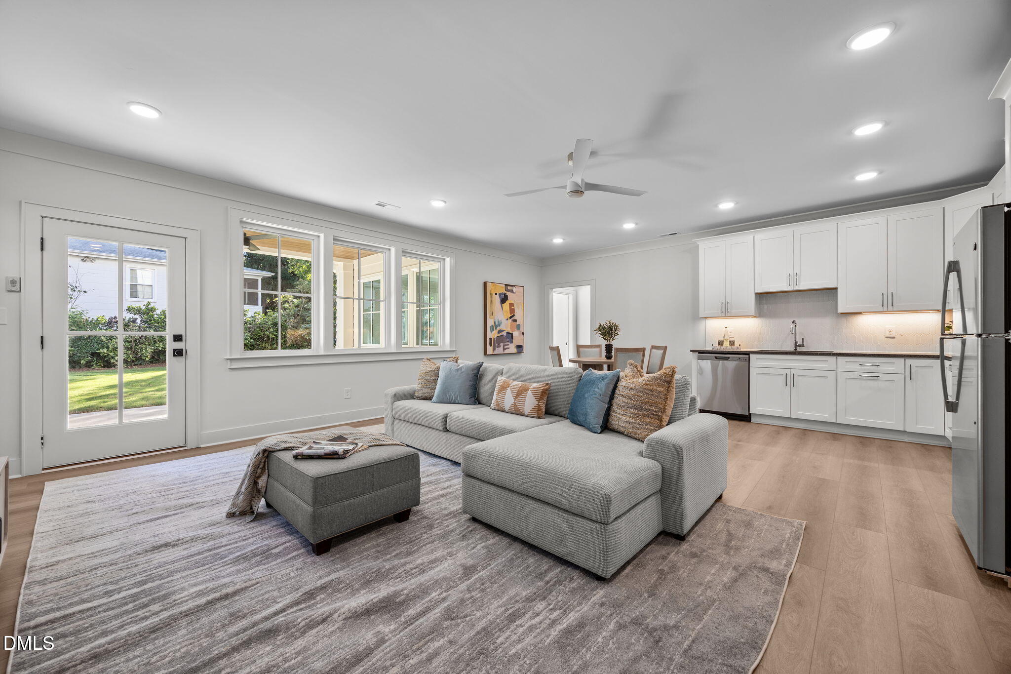 1000 Canterbury Road Raleigh, NC 27607 - Photo 32 of 46 a living room with furniture and a large window