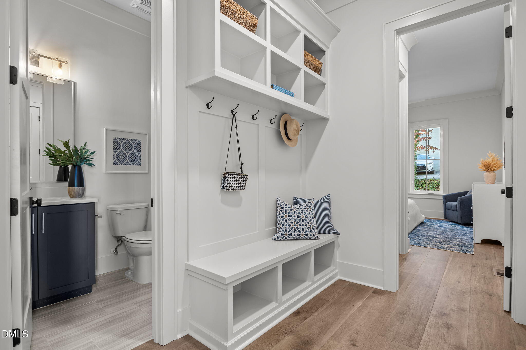 1000 Canterbury Road Raleigh, NC 27607 - Photo 37 of 46 a view of a hallway and dining room with wooden floor