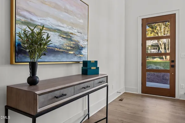 a room with a table and a potted plant