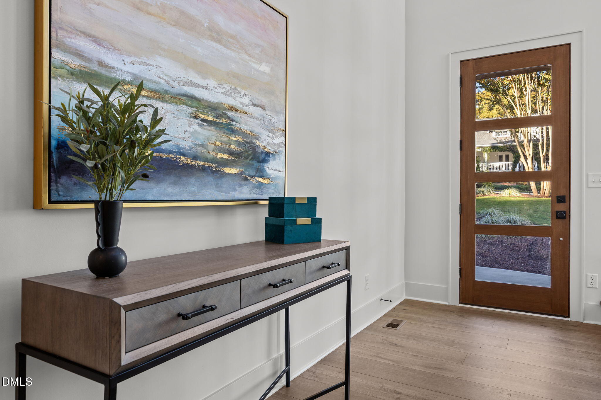 1000 Canterbury Road Raleigh, NC 27607 - Photo 4 of 46 a room with a table and a potted plant