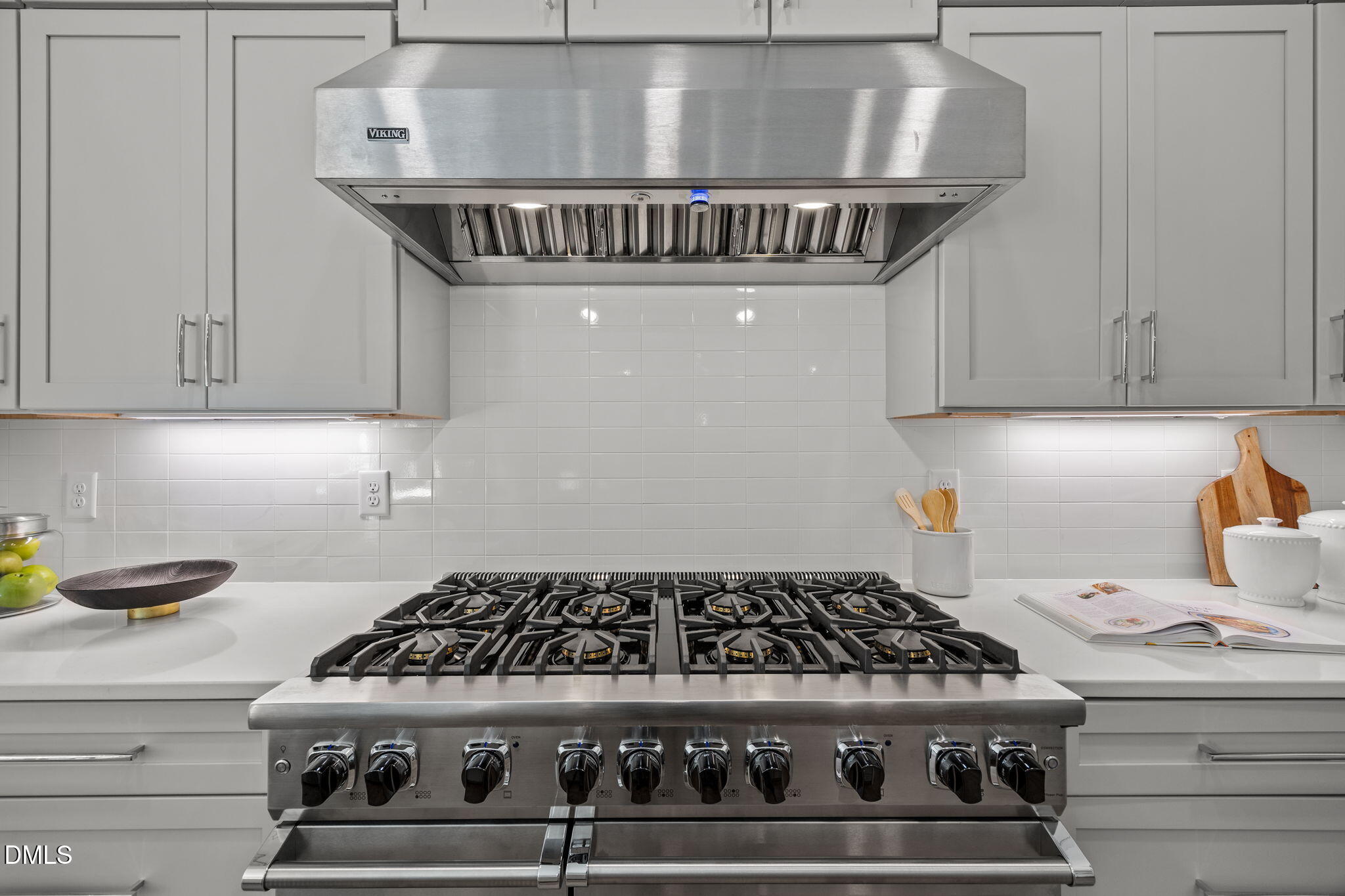 1000 Canterbury Road Raleigh, NC 27607 - Photo 7 of 46 a kitchen with a stove and cabinets