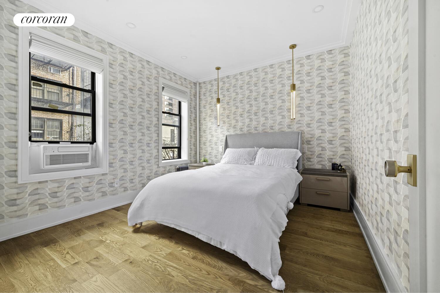 325 East 80th Street, Unit 4H Manhattan, NY 10075 - Photo 2 of 7 a bedroom with a bed and a window