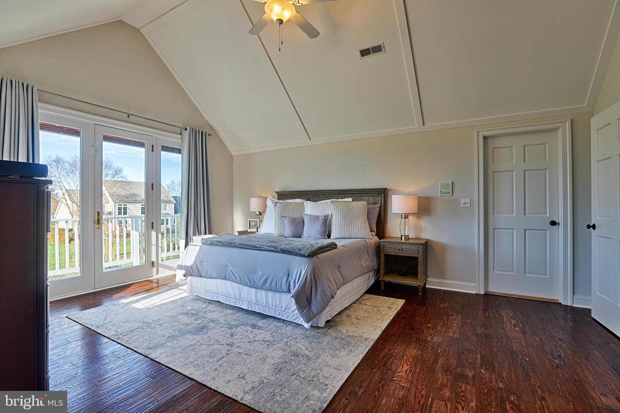 2902 Cox Neck Road East Chester, MD 21619 - Photo 25 of 57 a bedroom with a bed and a large window