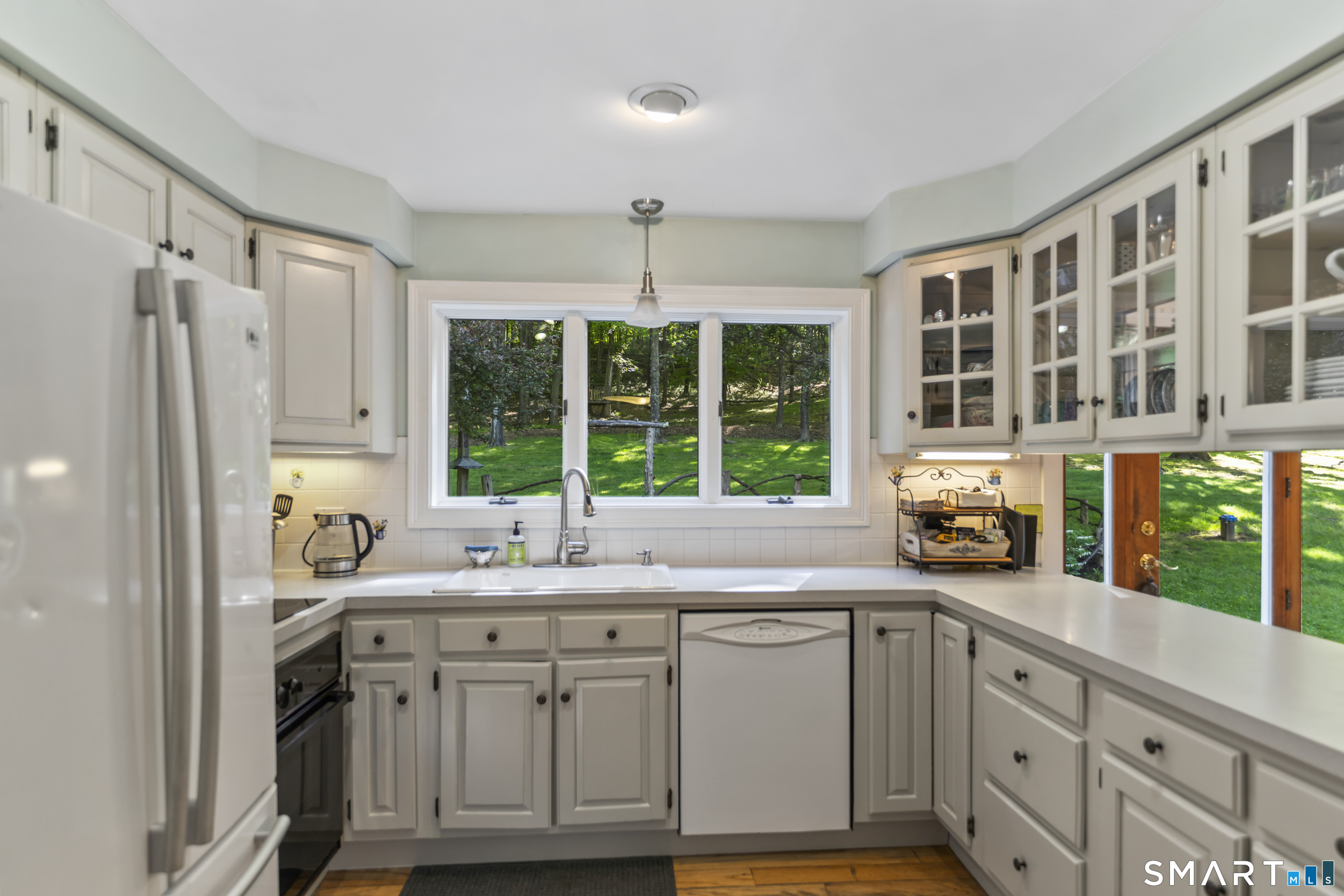 18 Gelding Hill Road Newtown, CT 06482 - Photo 6 of 40 a kitchen with stainless steel appliances a sink a window and cabinets