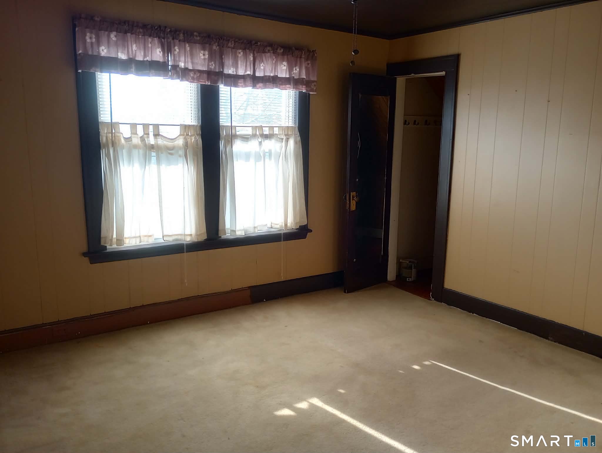 64 Moody Avenue Fairfield, CT 06825 - Photo 20 of 38 a view of an empty room with a window