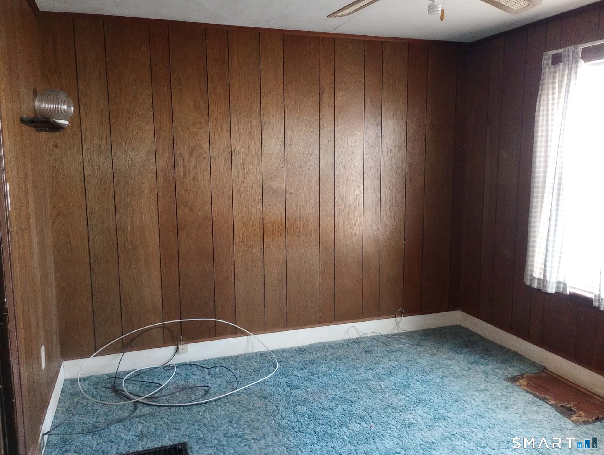 64 Moody Avenue Fairfield, CT 06825 - Photo 22 of 38 an empty room with windows