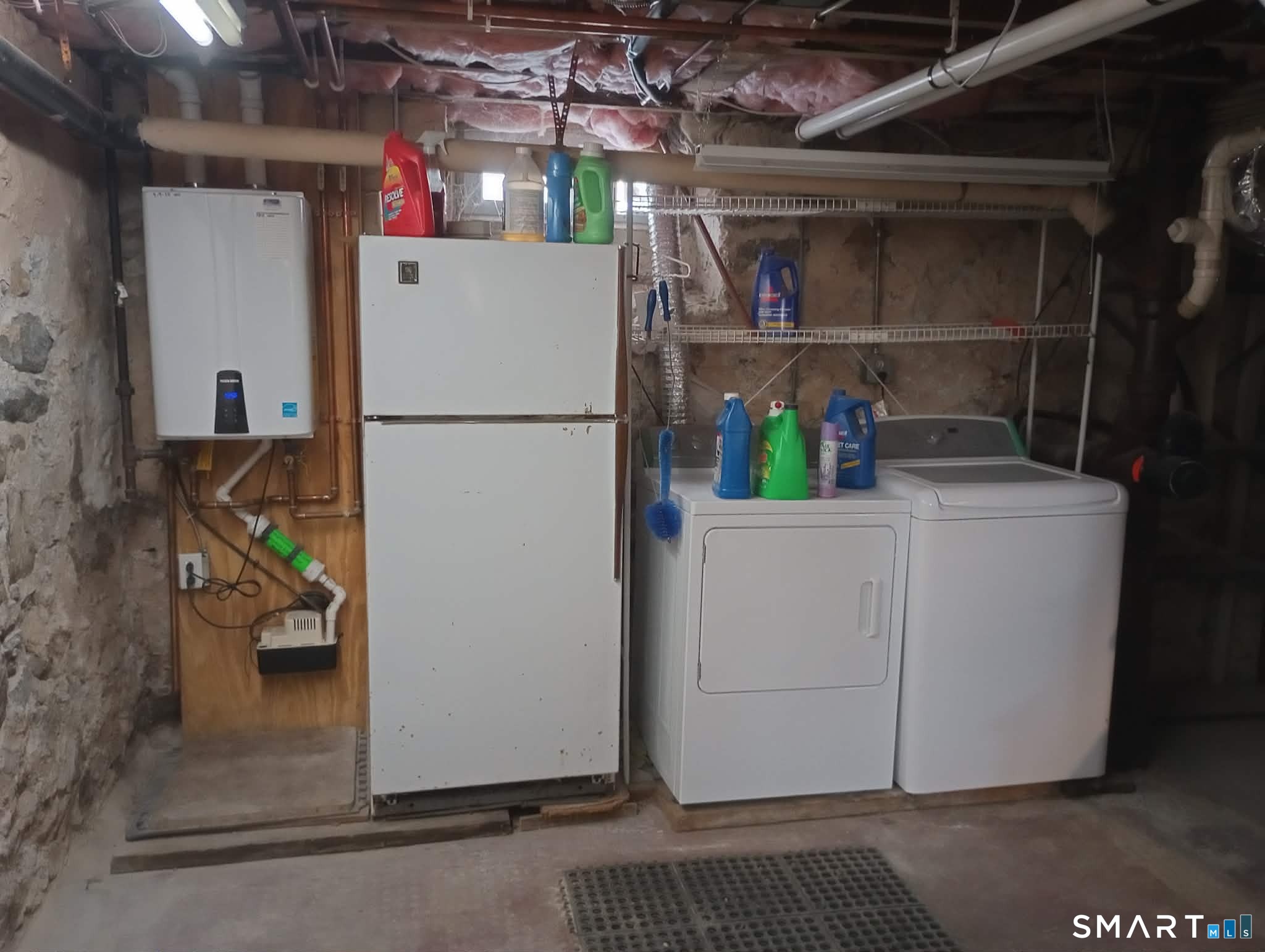 64 Moody Avenue Fairfield, CT 06825 - Photo 36 of 38 a view of storage and utility room with washer and dryer
