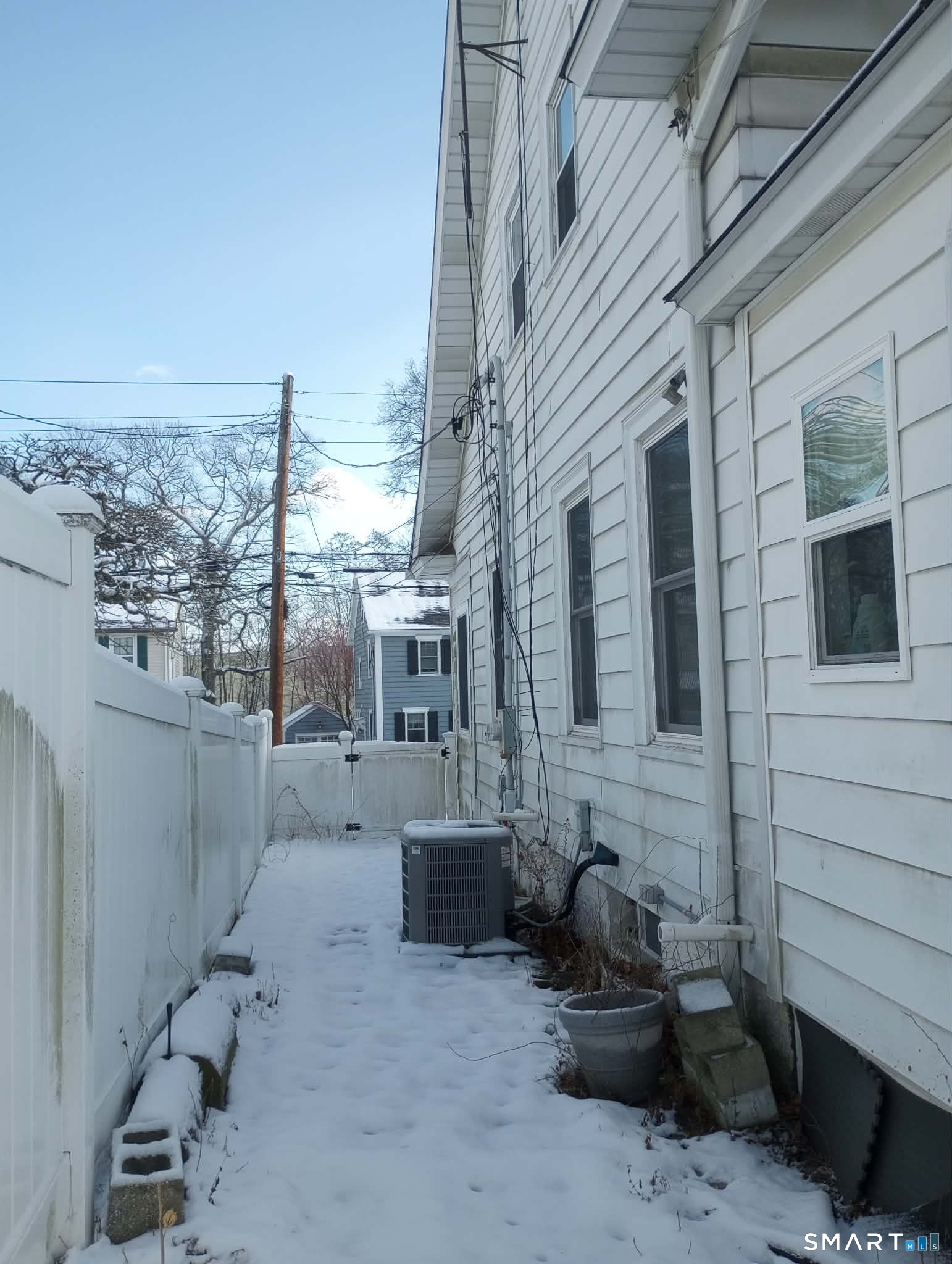 64 Moody Avenue Fairfield, CT 06825 - Photo 38 of 38 a view of a patio with table and chairs and potted plants