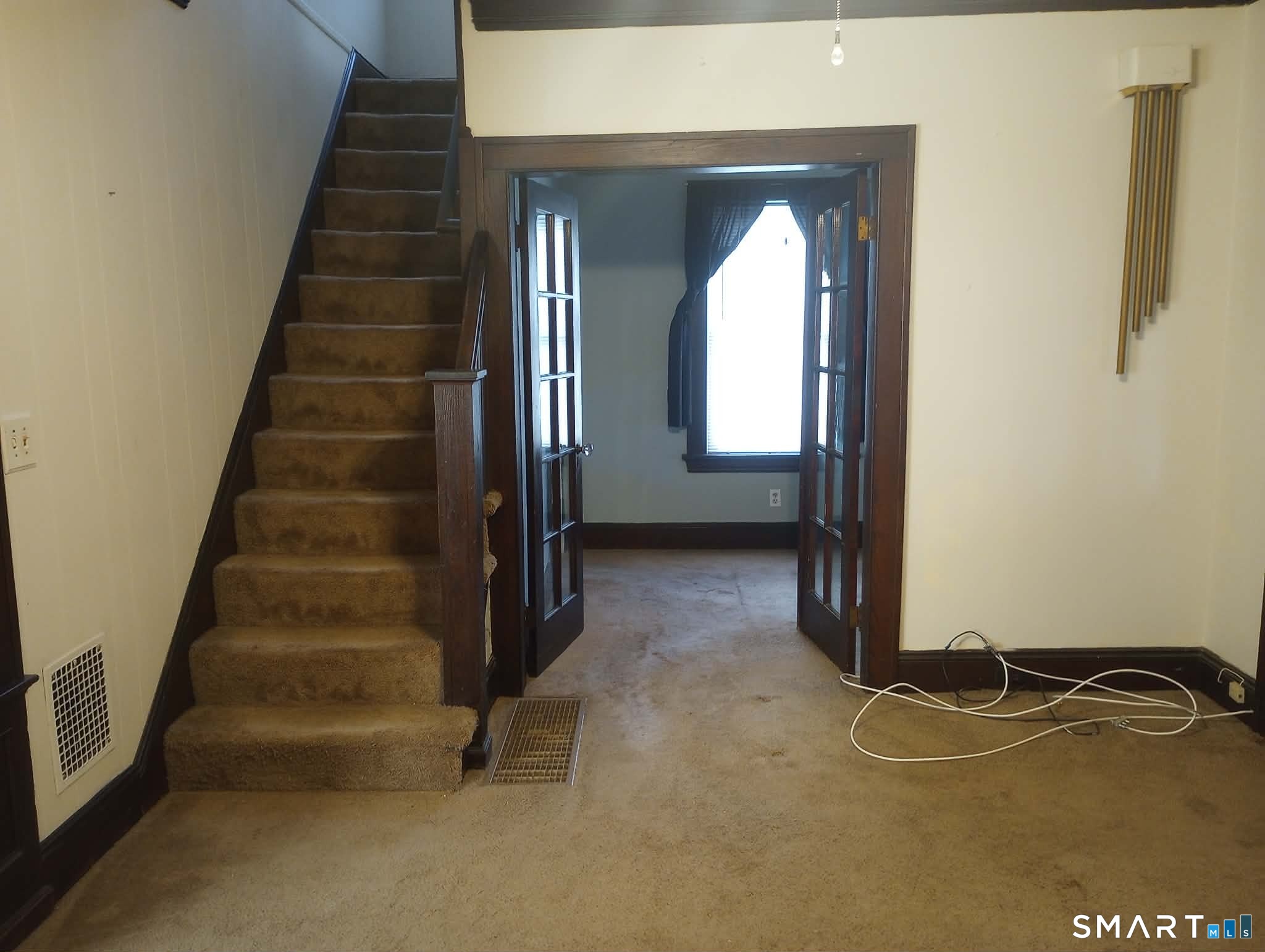 64 Moody Avenue Fairfield, CT 06825 - Photo 10 of 38 an empty room with windows