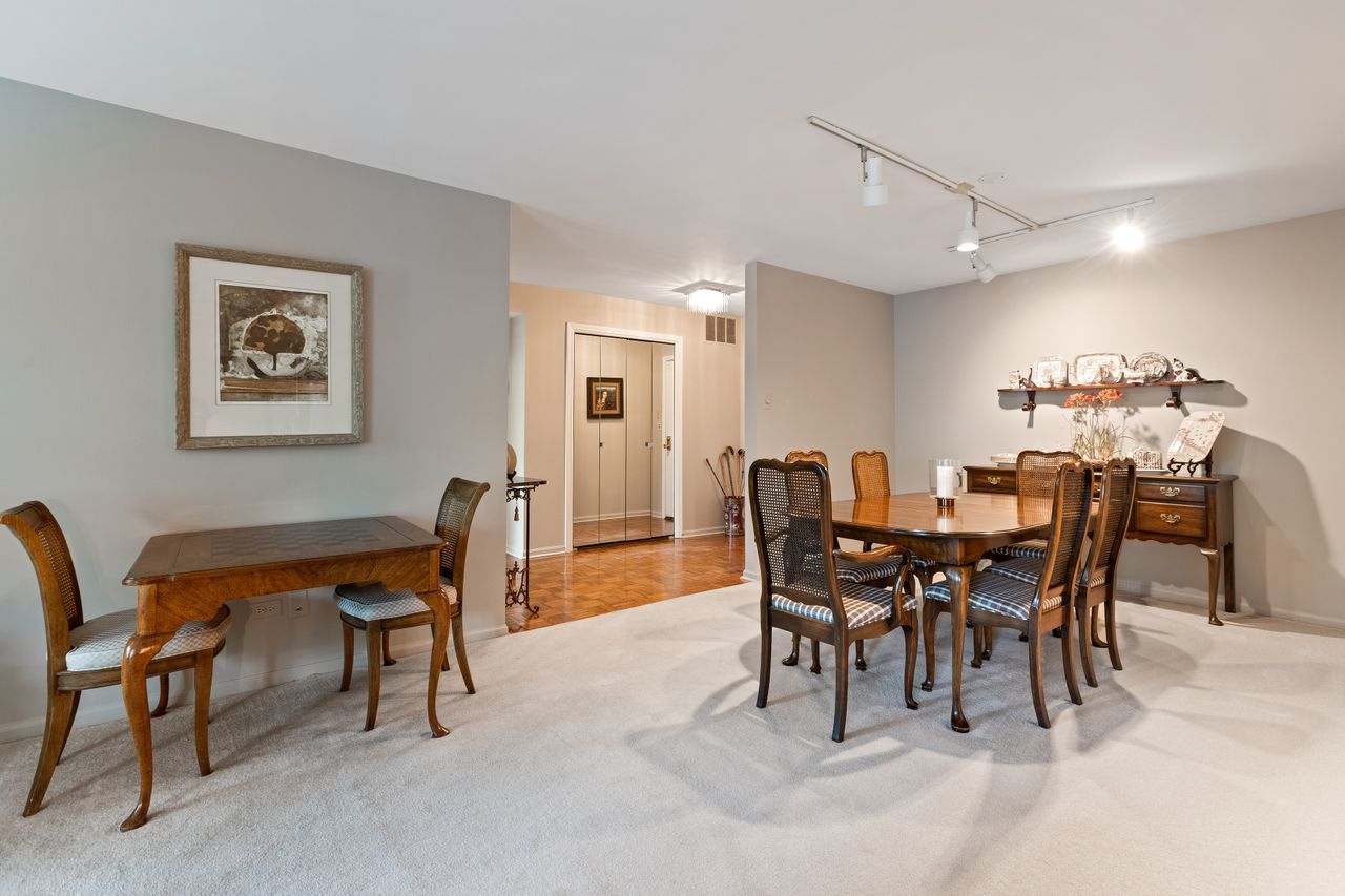 1125 Lake Cook Road, Unit 301E Northbrook, IL 60062 - Photo 7 of 16 a view of a dining room with furniture