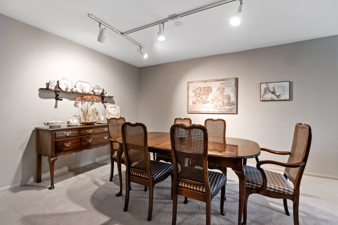 1125 Lake Cook Road, Unit 301E Northbrook, IL 60062 - Photo 8 of 16 a dining room with furniture and window