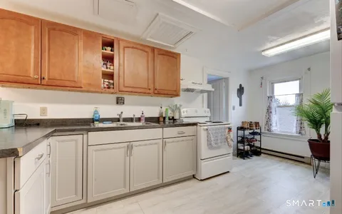 a kitchen with sink and cabinets