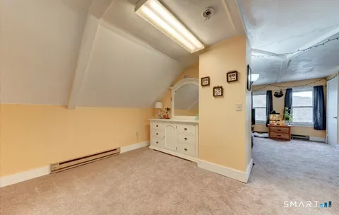 a view of a livingroom with furniture and a window