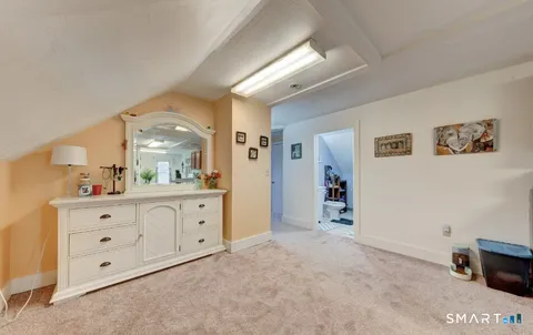 a spacious bathroom with a double vanity sink a mirror and a