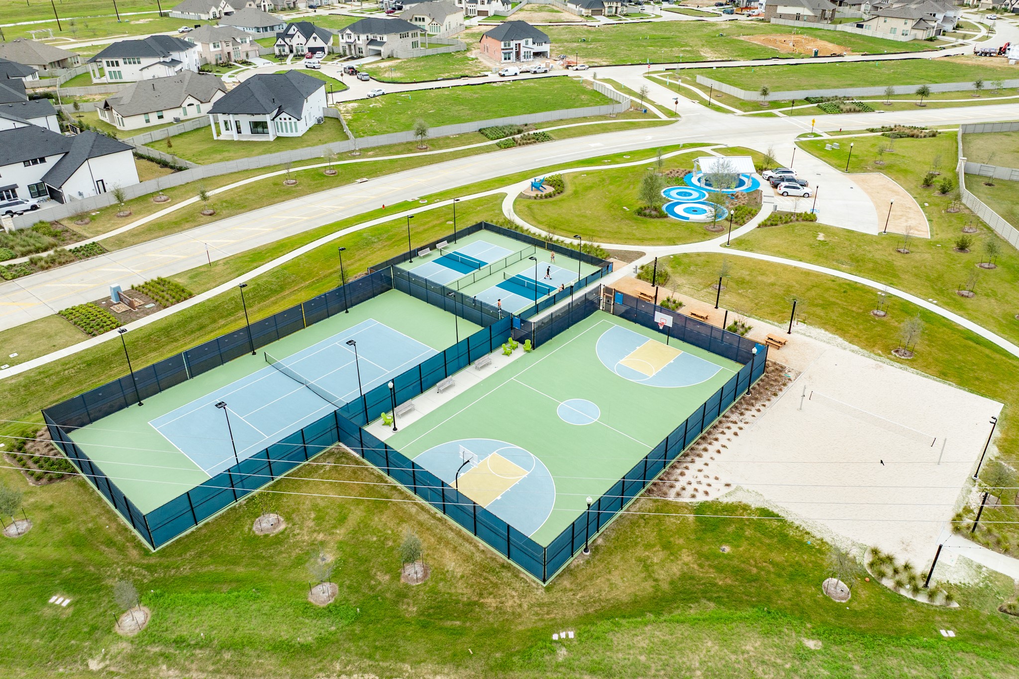 5138 Walnut Grv Lane Manvel, TX 77578 - Photo 36 of 43 a blue swimming pool with a garden and plants