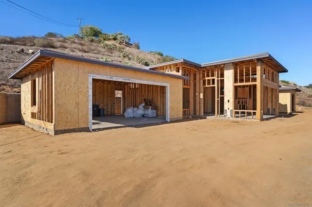 a view of a house with a terrace patio and kitchen view