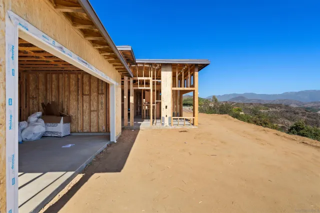 a view of a house with backyard and porch