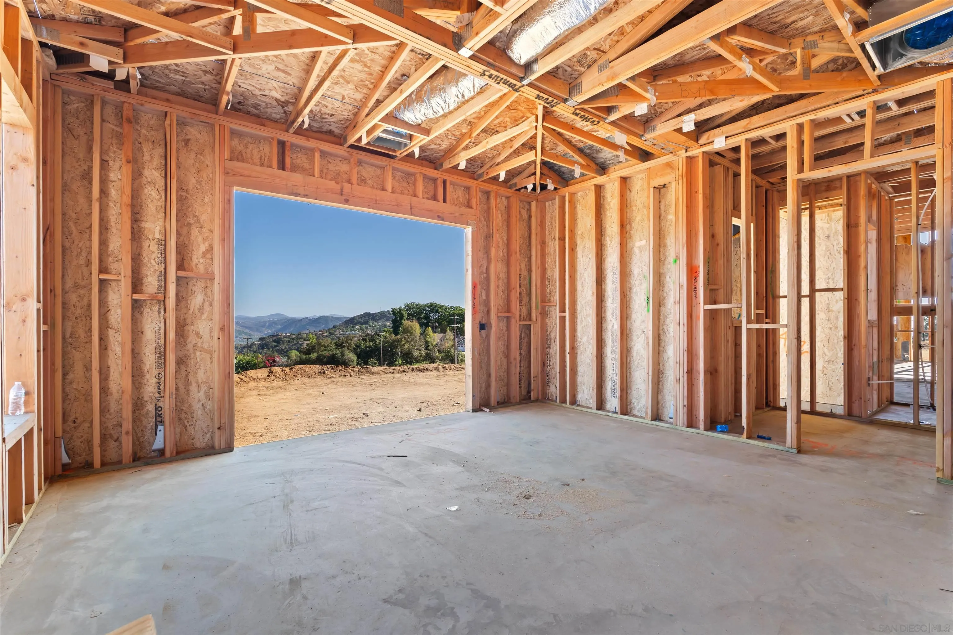 3916 Citrus Drive Fallbrook, CA 92028 - Photo 29 of 36 a view of a room with wooden walls and a shower curtain