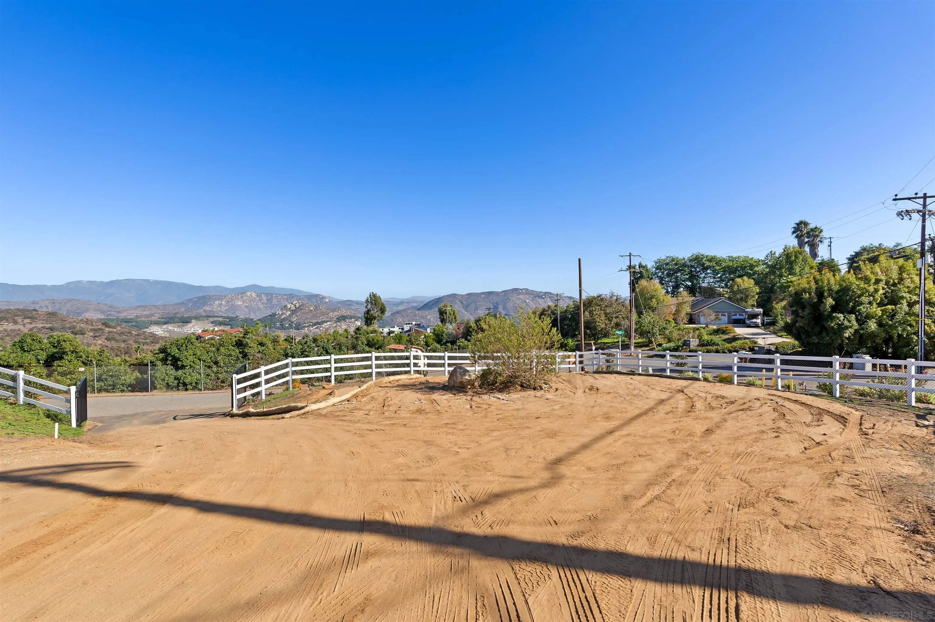 3916 Citrus Drive Fallbrook, CA 92028 - Photo 32 of 36 a view of a swimming pool with a yard and mountain view