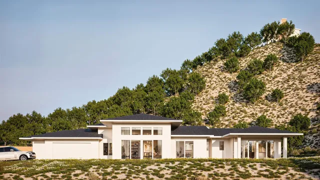 a front view of a house with a garden