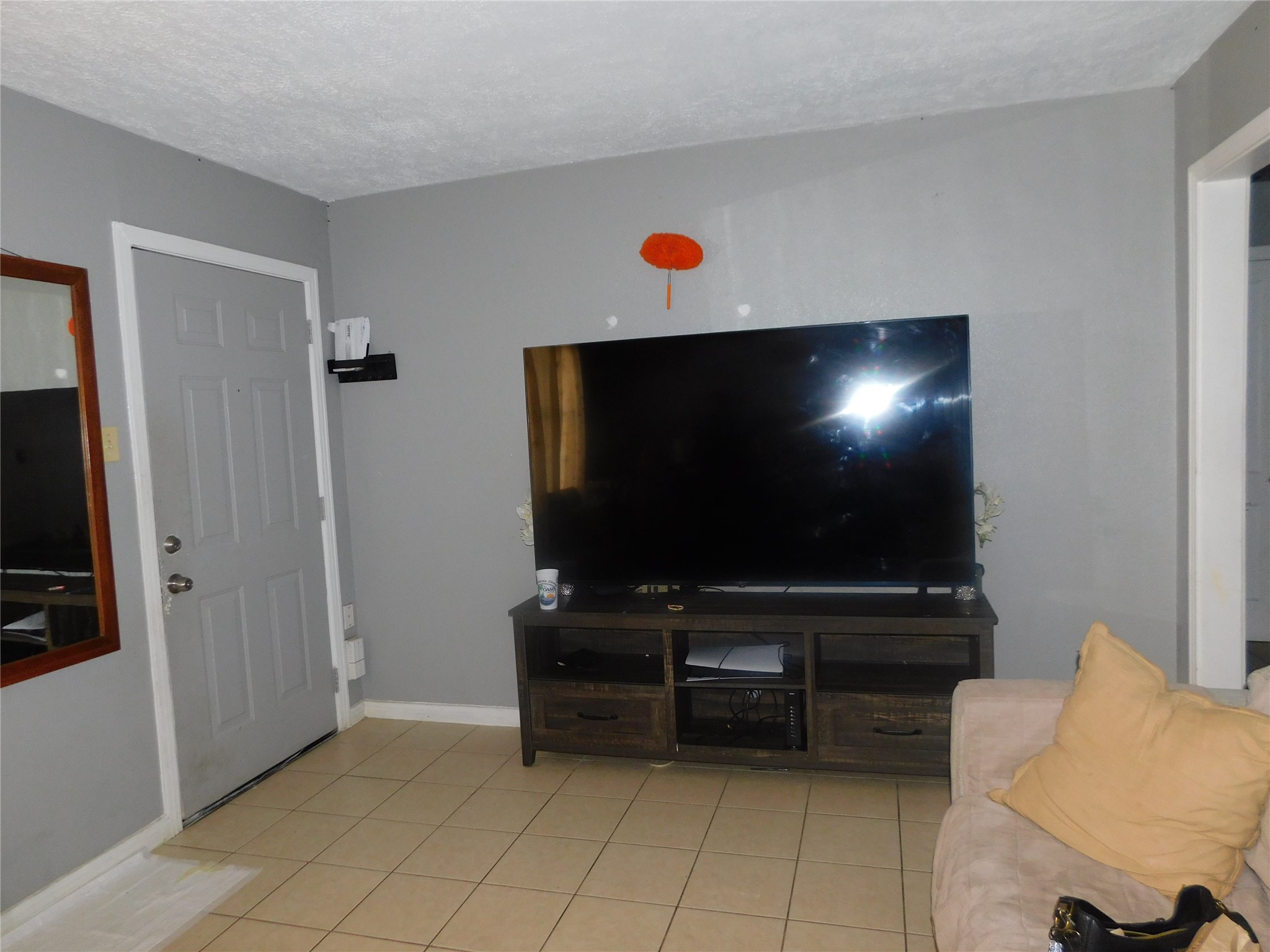 1716 Roxella Street Houston, TX 77093 - Photo 3 of 14 a living room with furniture and a flat screen tv