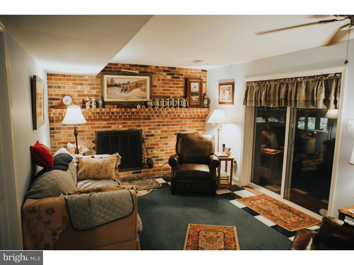 153 Silver Springs Road Phoenixville, PA 19460 - Photo 10 of 15 LL Family room with Fp & Slider to outside patio