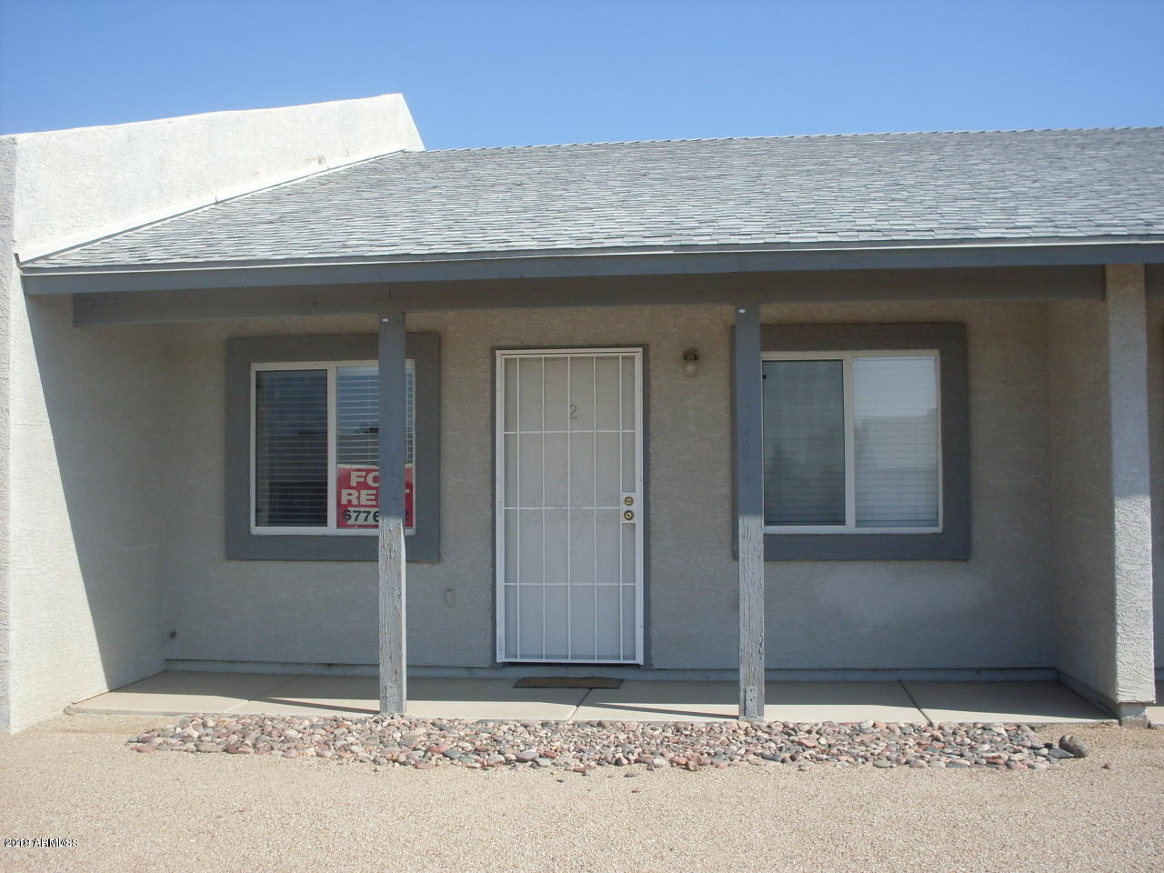 1497 East 26th Lane, Unit 2 Apache Junction, AZ 85119 - Photo 5 of 6 a front view of a house