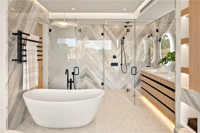 a white bath tub sitting next to a white sink