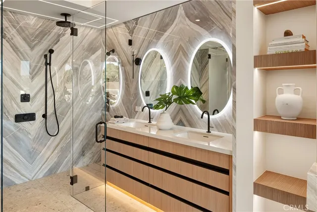 a bathroom with a mirror and a sink