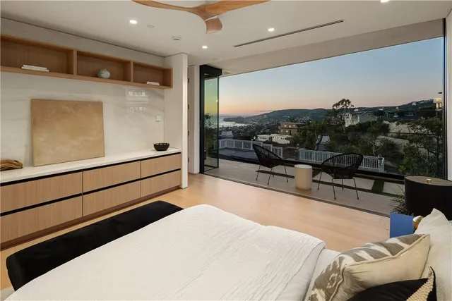 a living room with a couch and a floor to ceiling window