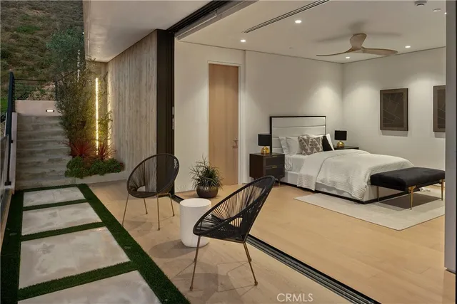 a bedroom with a bed and a dresser