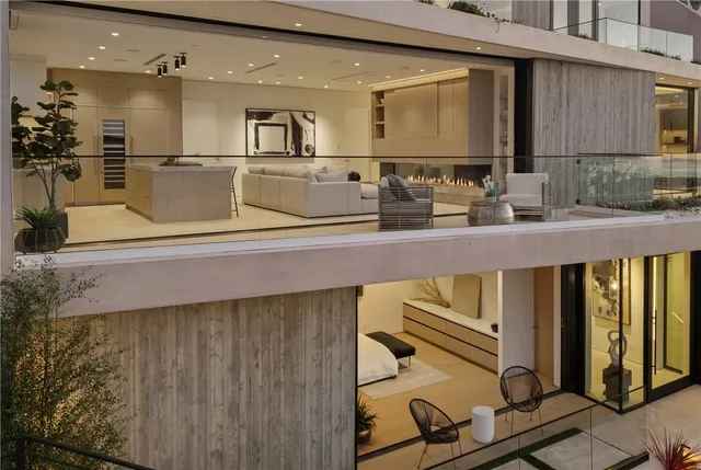 a view of a living room with furniture and wooden floor