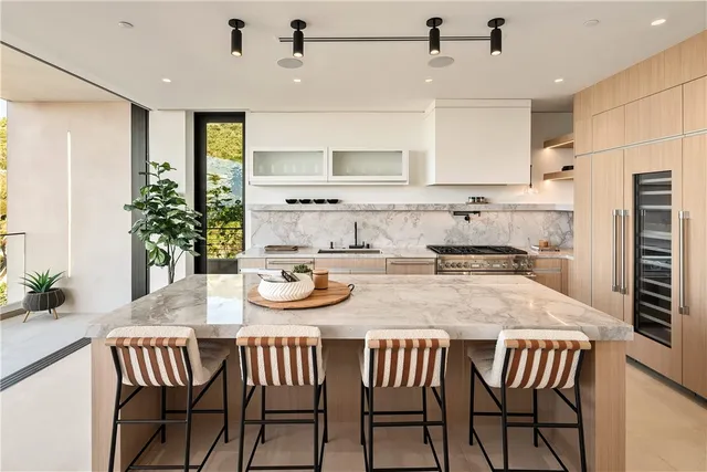 a kitchen with a table and chairs in it