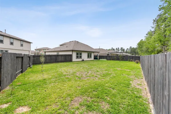 a house view with a garden space