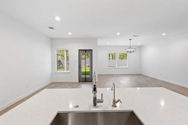 a view of a kitchen with a sink and window