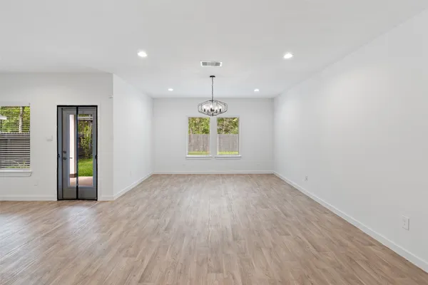 an empty room with window and outdoor view