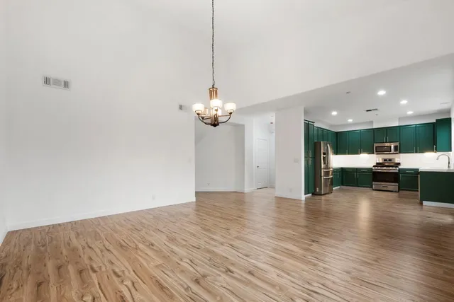 a kitchen with stainless steel appliances a refrigerator and a sink