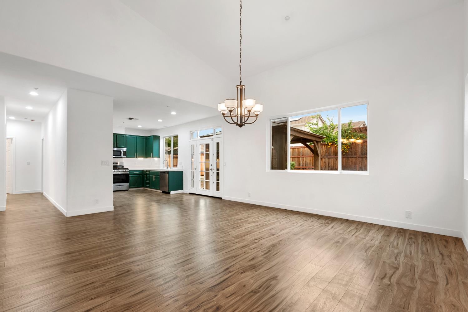 624 Snapdragon Street Winters, CA 95694 - Photo 14 of 65 a view of an empty room with wooden floor and a window