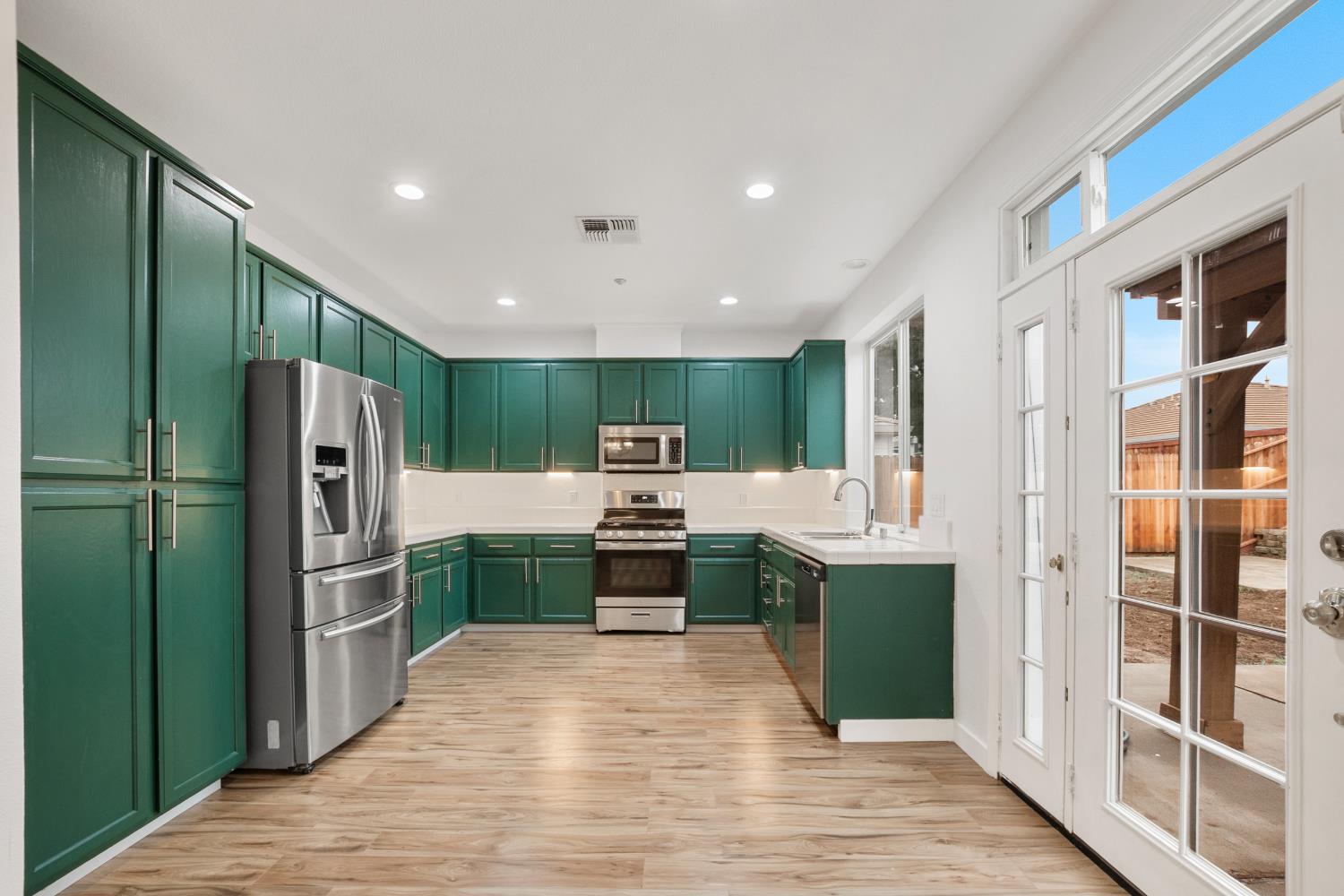 624 Snapdragon Street Winters, CA 95694 - Photo 15 of 65 a kitchen with stainless steel appliances a refrigerator and a sink