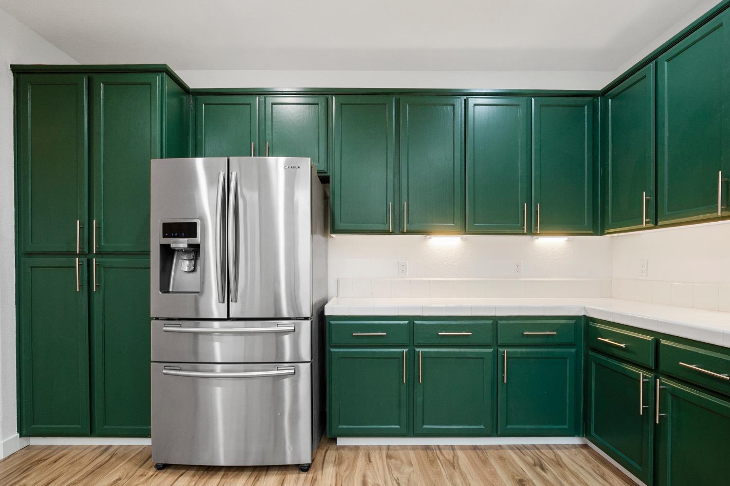 624 Snapdragon Street Winters, CA 95694 - Photo 17 of 65 a kitchen with a refrigerator and cabinets