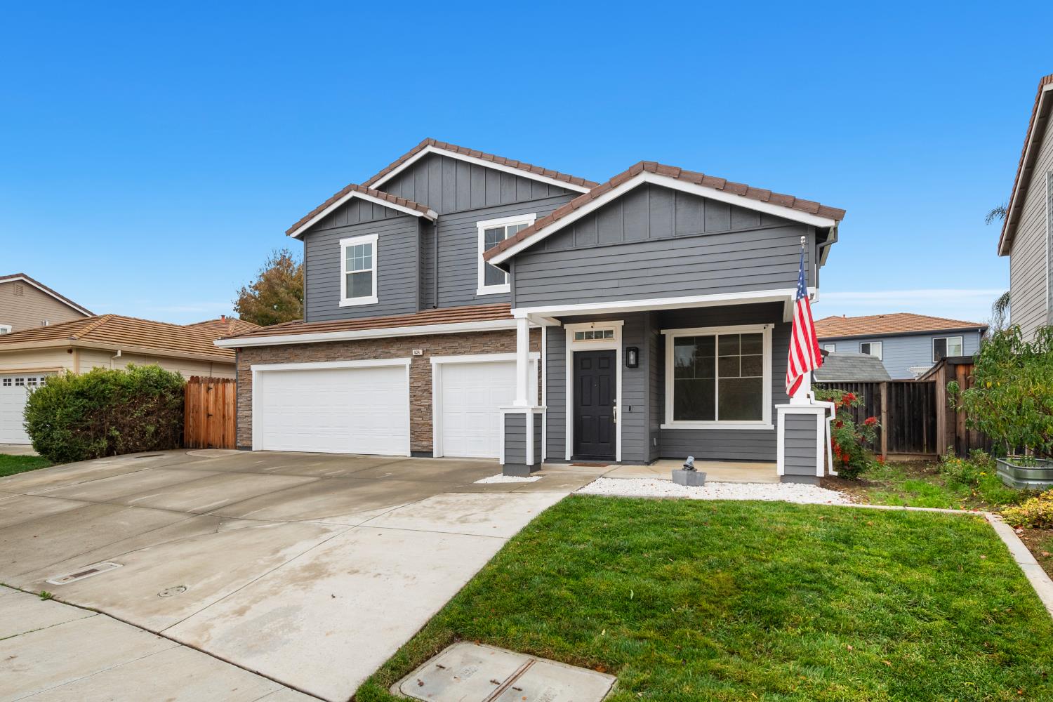 624 Snapdragon Street Winters, CA 95694 - Photo 2 of 65 a front view of a house with yard and green space