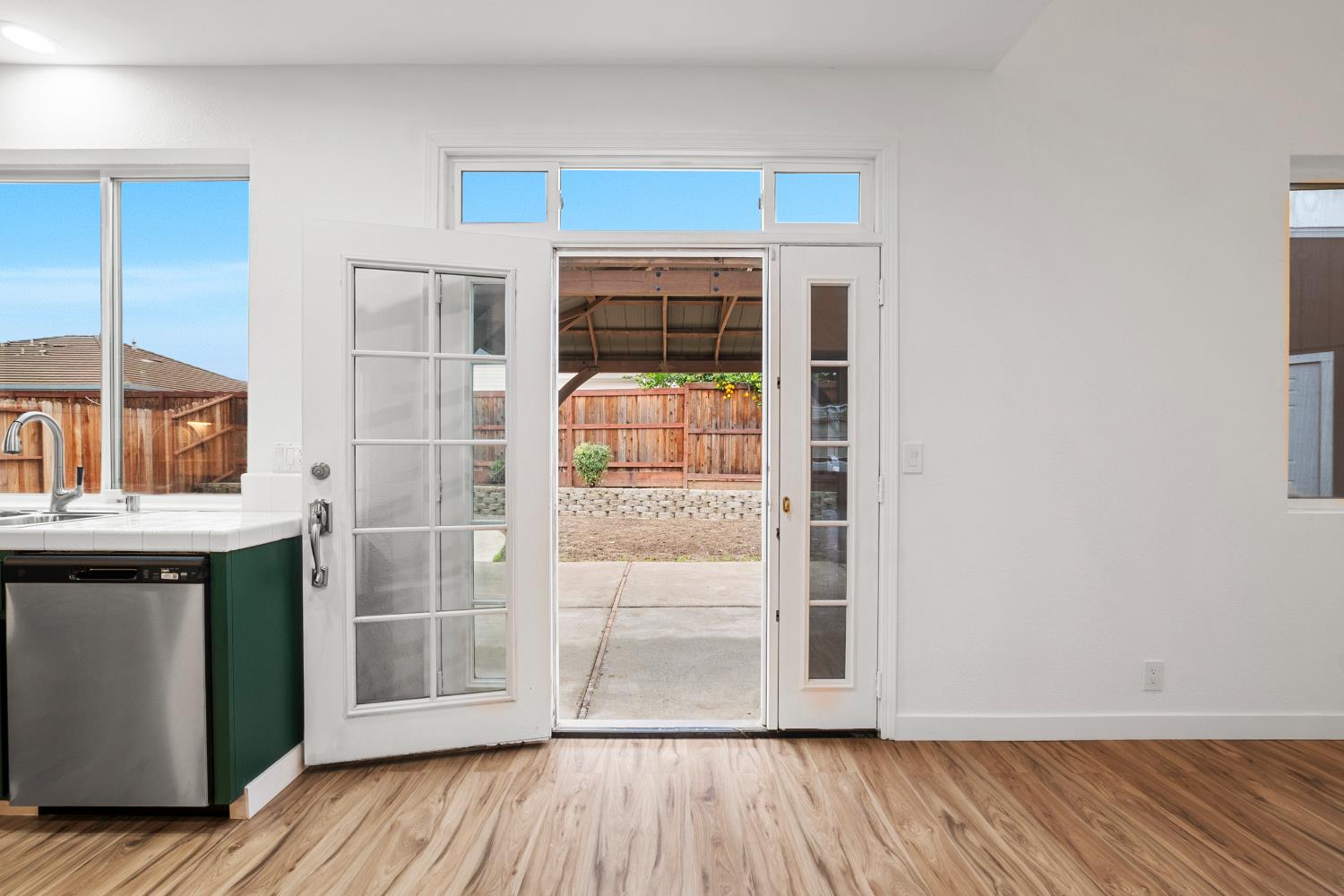 624 Snapdragon Street Winters, CA 95694 - Photo 21 of 65 an empty room with wooden floor cabinet and windows