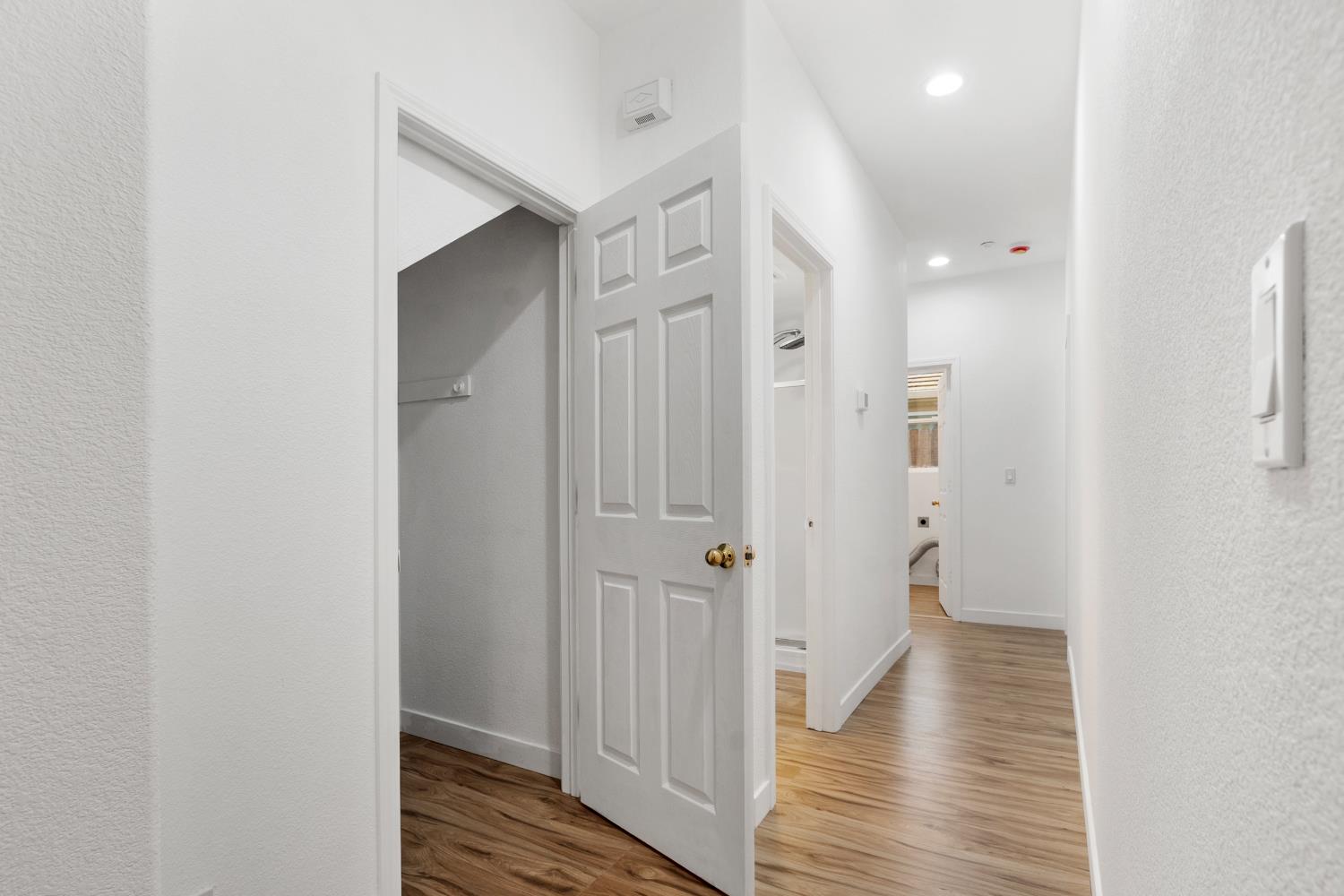 624 Snapdragon Street Winters, CA 95694 - Photo 22 of 65 a view of a hallway with wooden floor