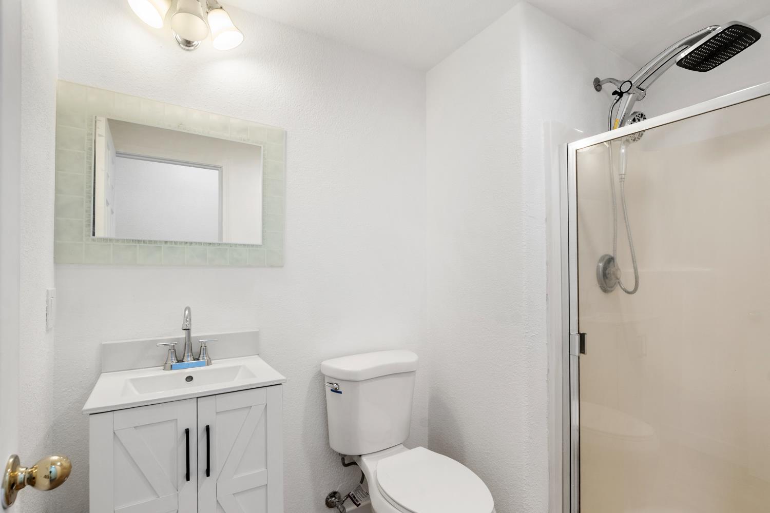 624 Snapdragon Street Winters, CA 95694 - Photo 23 of 65 a bathroom with a toilet sink shower and mirror